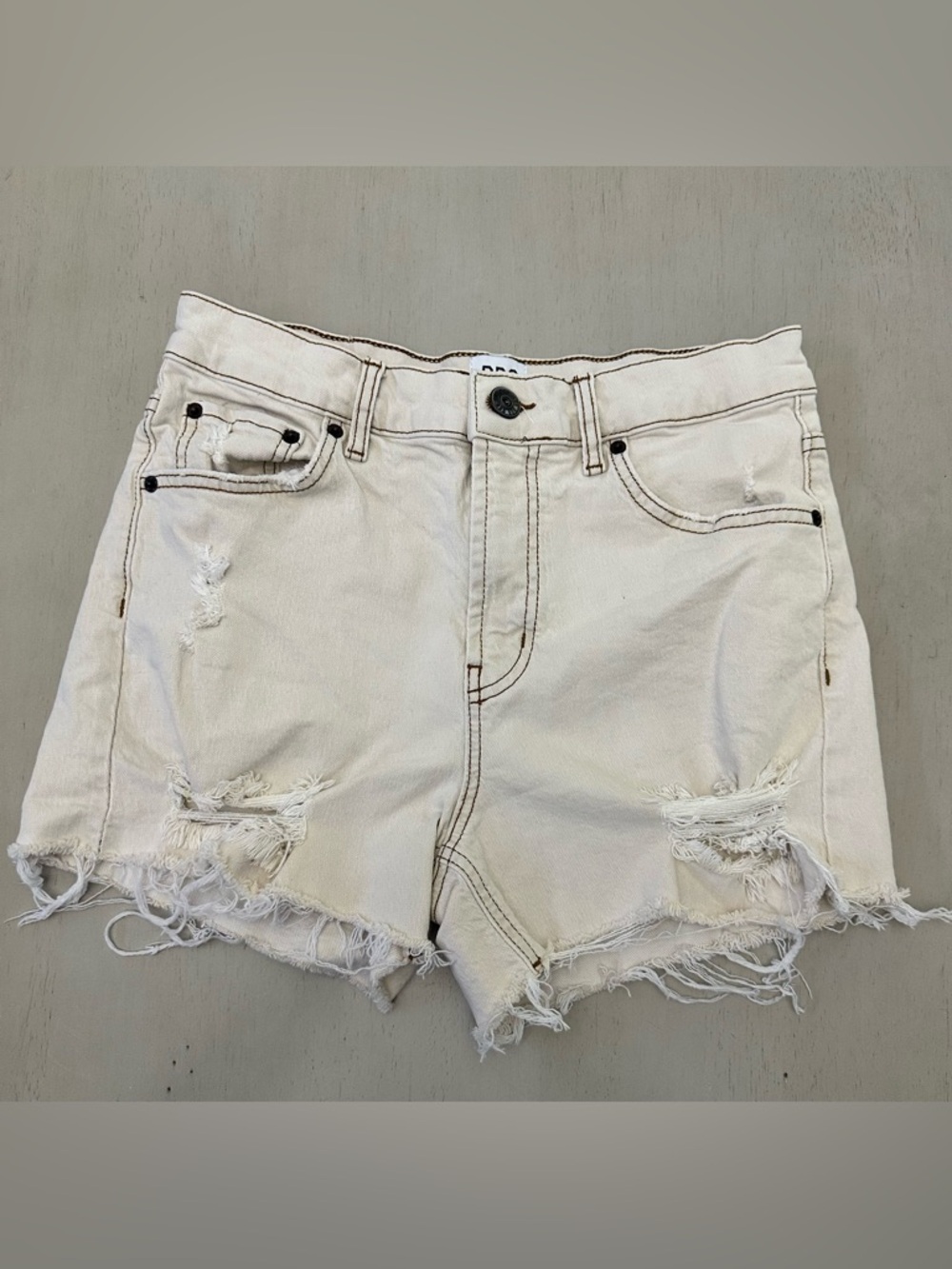 BDG Cream Distressed High-Rise Denim Cowgirl Shorts - size W29